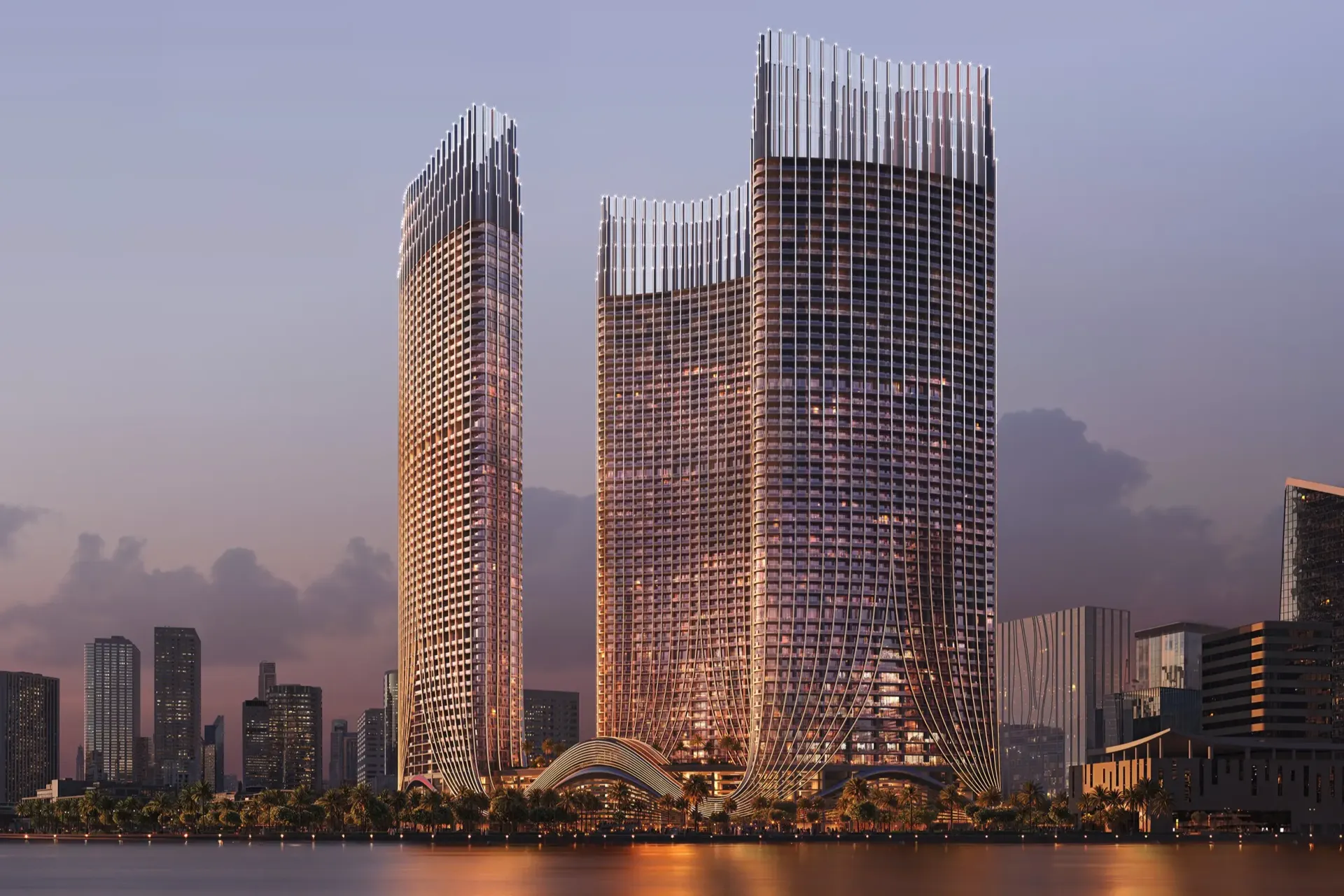 Binghatti Skyrise – trys bokštai su krištoliniu fasadu iš viršaus tarp debesų